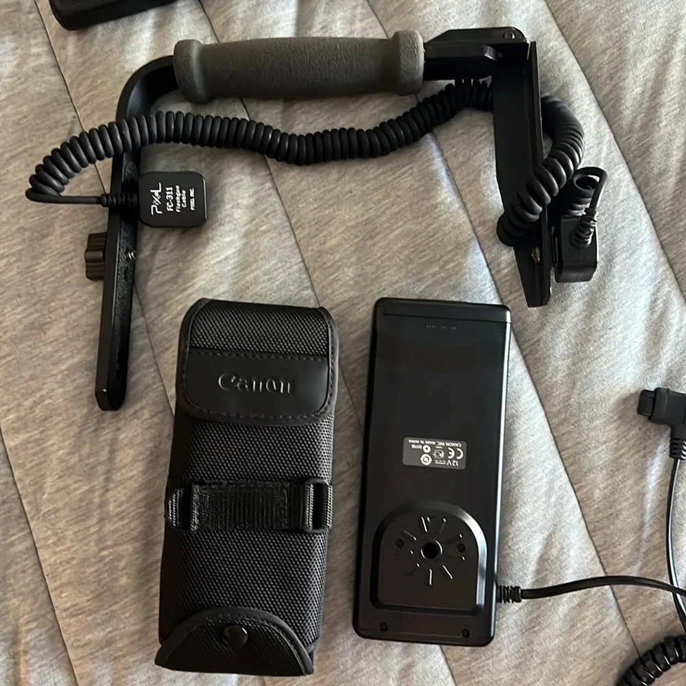 Canon batter pack with case and camera frame with flashgun cable